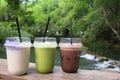 Three glasses of drink - iced cocoa, green tea and frappe coconut juice Royalty Free Stock Photo