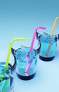 Three glasses of fresh water with ice cubes cocktail sticks Royalty Free Stock Photo