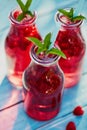 Three glasses of lemonade with raspberries Royalty Free Stock Photo