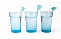Three glasses of mineral water with straw Royalty Free Stock Photo