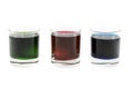 Three glasses with multi-coloured cocktails Royalty Free Stock Photo