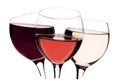 Three glasses with red, rose and white wine on white background Royalty Free Stock Photo