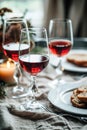 Three glasses of red wine on a dining table with candles Royalty Free Stock Photo