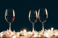 Glasses of wine and fairylights Royalty Free Stock Photo