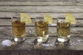 Three glasses of tequila with lemon and salt Royalty Free Stock Photo