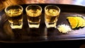 Three glasses of tequila, side view