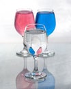 Three glasses of water showing reflections with distortions Royalty Free Stock Photo