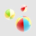 Three glossy colorful inflatable balls
