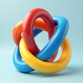 Three glossy, interlocking torus shapes in red, blue, and yellow create a complex, three-dimensional abstract knot. This vibrant, Royalty Free Stock Photo