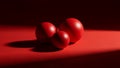 Three Glossy Red Spheres Casting Shadows on Smooth Gradient Red Background reflective Royalty Free Stock Photo