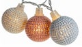 Three Glowing Decorative String Lights with Textured Spheres on White Background Royalty Free Stock Photo