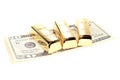 Three gold bars on dollar bills Royalty Free Stock Photo