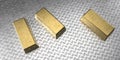 Three gold bars of 1000 grams are located on a metal sheet with notches. 3d rendering Royalty Free Stock Photo