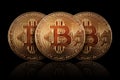 Three Gold Bitcoin on dark background. Banking business.