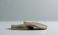 Three gold coins stacked on gray surface Royalty Free Stock Photo