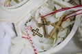 Three gold small christening crosses during the baptism ritual in armenian church Royalty Free Stock Photo