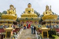 The three golden Buddha statues at Swayambhu Amideva Buddha Park Kathmandu Nepal