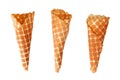 Three golden crispy ice cream waffle cones on white background isolated closeup top view Royalty Free Stock Photo