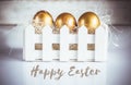 Three golden easter eggs on white background Royalty Free Stock Photo