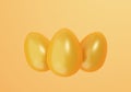 Three Golden Easter Eggs on yellow background