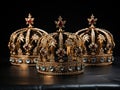 three golden royal crowns with precious stones with