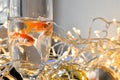 Goldfishes in a glass with water on the window day Royalty Free Stock Photo