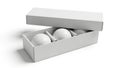 Three golf balls in a box, isolated on white background Royalty Free Stock Photo