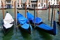 Three gondolas docked in a row in Venice, Italy Royalty Free Stock Photo