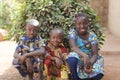 Three gorgeous African children posing outdoors Smiling and Laughing