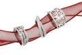 Three exquisite white gold diamond rings on a red twisted mesh ribbon