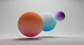Three gradient spheres in varying sizes float against a neutral gray background. The Royalty Free Stock Photo