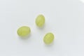 Three grapes close up on a white background Royalty Free Stock Photo