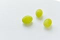 Three grapes close up on a white background Royalty Free Stock Photo