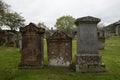 Three gravestones in a graveyard in Scotland