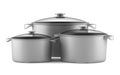 Three gray cooking pans on white