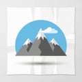 Three gray peaks, with white snowcaps against a blue circular Royalty Free Stock Photo