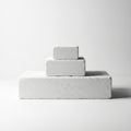 Three gray rectangular blocks arranged in a pyramid on a white background Royalty Free Stock Photo
