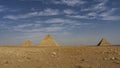 The three great pyramids of Giza on a background of blue sky and clouds. Royalty Free Stock Photo