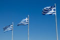 Three greek flags and a blue sky Royalty Free Stock Photo