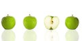 Three green apples and a half Royalty Free Stock Photo
