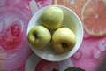 Three green apples in a plate Royalty Free Stock Photo