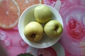 Three green apples in a plate Royalty Free Stock Photo