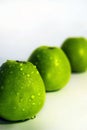 Three green apples on white background Royalty Free Stock Photo