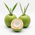 Three green coconuts with one cut open to show the white interior Royalty Free Stock Photo