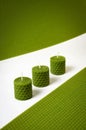 Three green colored candles with beeswax Royalty Free Stock Photo