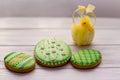 Three green easter cookies with a chik