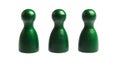 Three green pawn game figures