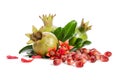 Three green pomegranates, seeds and leaves with petals on white Royalty Free Stock Photo