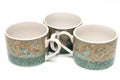 Three green printed teacups