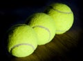 Three green tennis balls